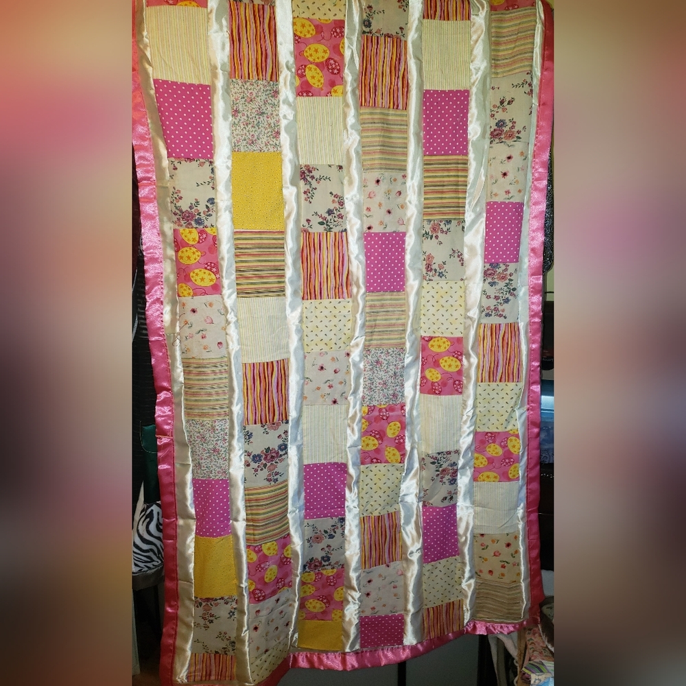 Patchwork Quilt with Pink and Yellow Accents
